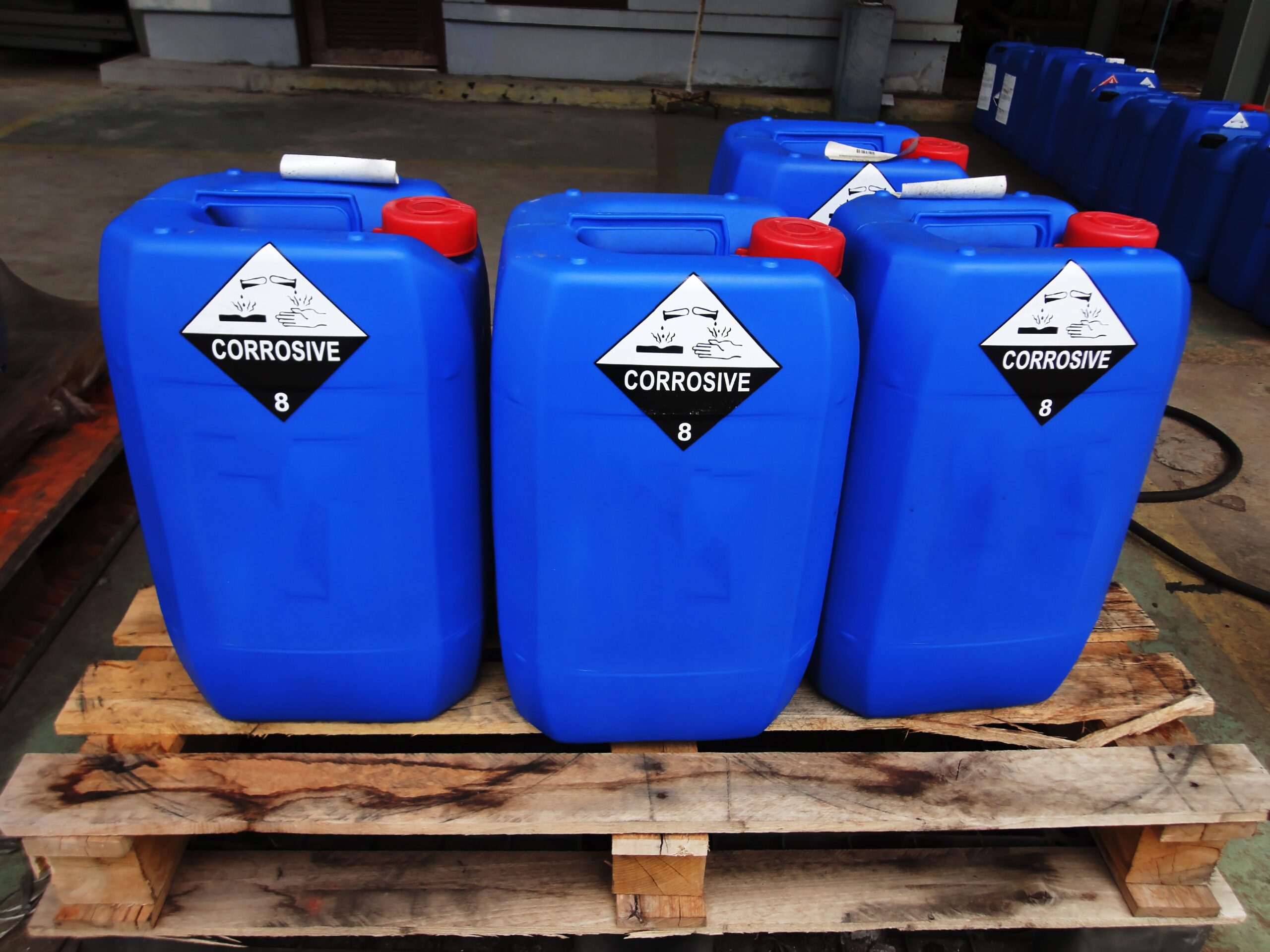 Large container of Hazardous Substances with warning labels on them